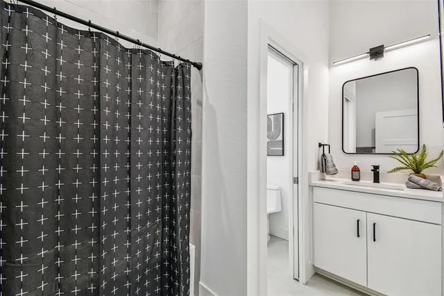 a view of a hallway with wooden floor and entryway