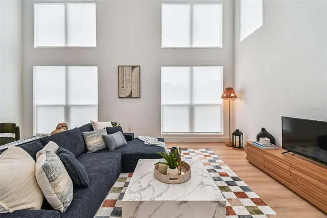 a kitchen with granite countertop a sink a counter space appliances and cabinets