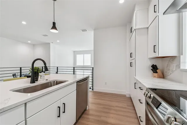 a bathroom with double vanity sinks and a mirror