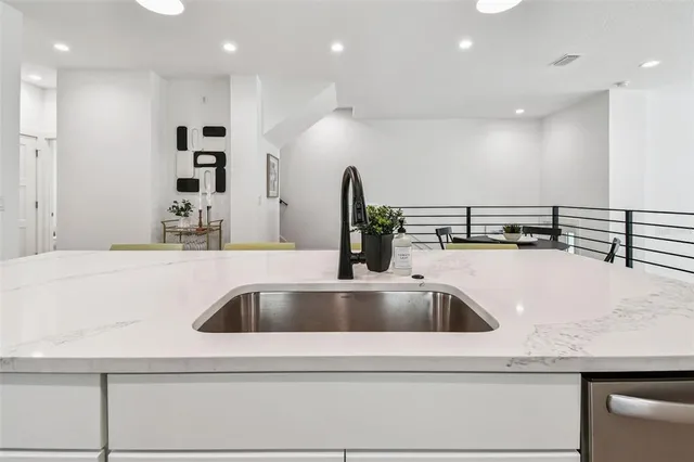 a bathroom with a double vanity sink mirror and shower