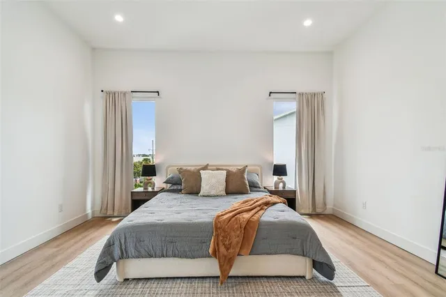 a bathroom with a double vanity sink mirror and shower