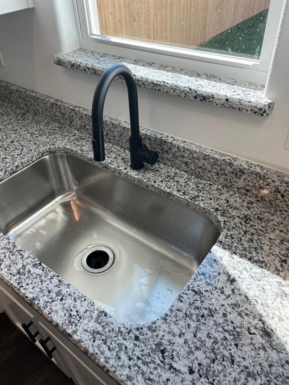 512 East Gandy Street Denison, TX 75021 - Photo 7 of 11 Kitchen view of light stone counters