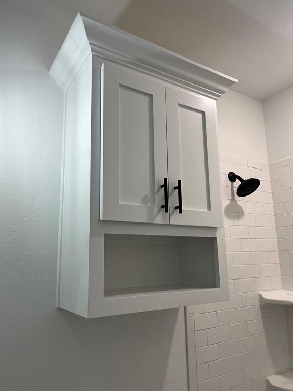 512 East Gandy Street Denison, TX 75021 - Photo 10 of 11 Full bath featuring tiled shower