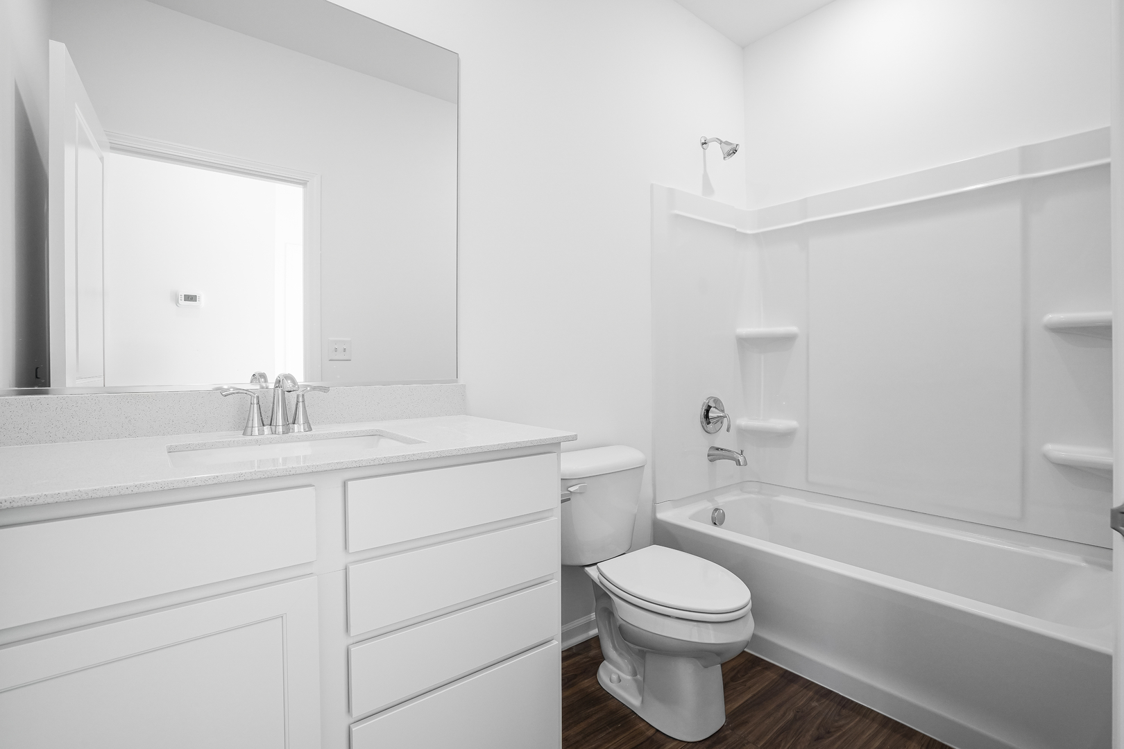 12231 Barcroft Circle Huntley, IL 60142 - Photo 6 of 38 a bathroom with a sink a toilet and a bathtub