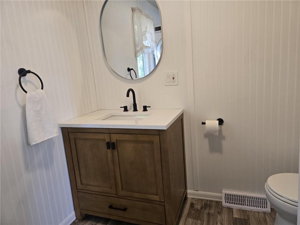 133 Freeport Road Butler, PA 16002 - Photo 13 of 26 a bathroom with a sink toilet and a mirror