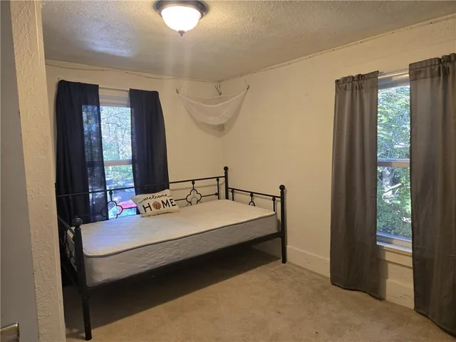 a view of an empty room with stairs