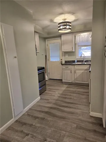 a kitchen with stainless steel appliances granite countertop a stove and a refrigerator