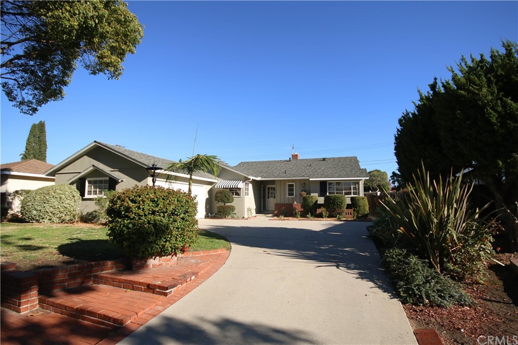 1402 Riverside Drive Fullerton, CA 92831 - Photo 1 of 1 Home front with driveway and 2-car garage access. The home has been freshly painted inside and outside.