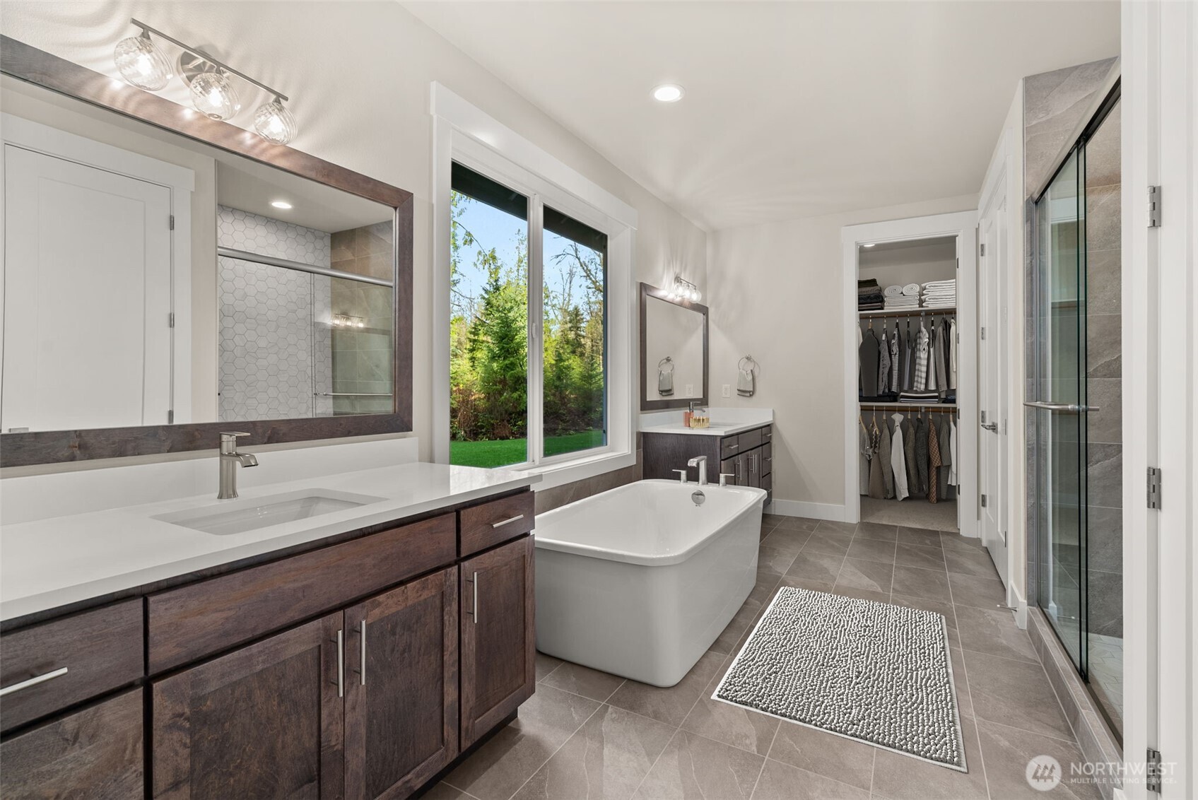 3303 107th Avenue Southwest Olympia, WA 98512 - Photo 17 of 37 a large spacious bathroom with a tub double sink and mirror