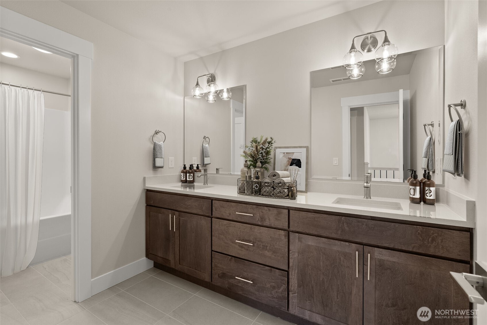3303 107th Avenue Southwest Olympia, WA 98512 - Photo 25 of 37 a bathroom with double vanity sinks and a mirror