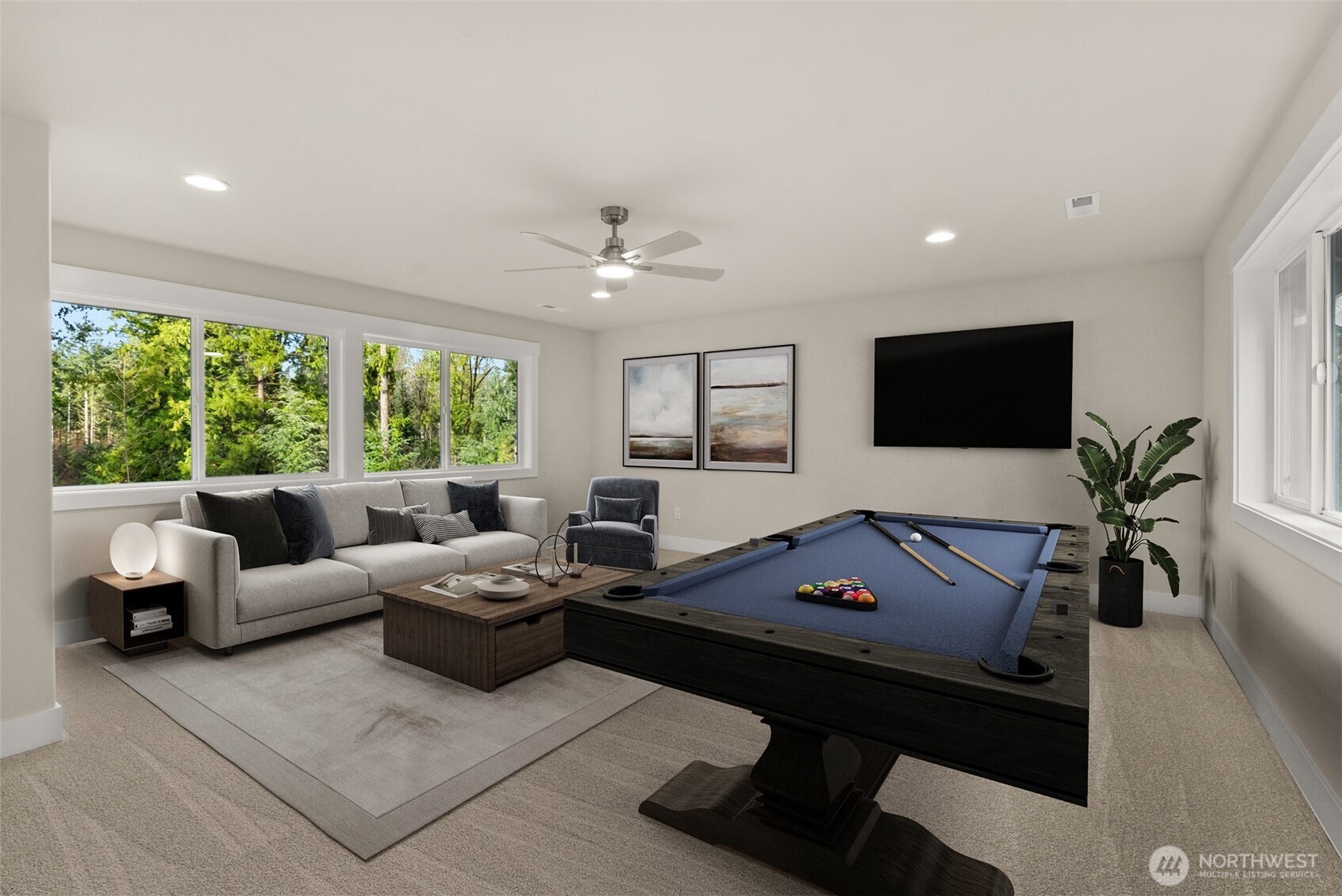 3303 107th Avenue Southwest Olympia, WA 98512 - Photo 27 of 37 a living room with furniture and a flat screen tv