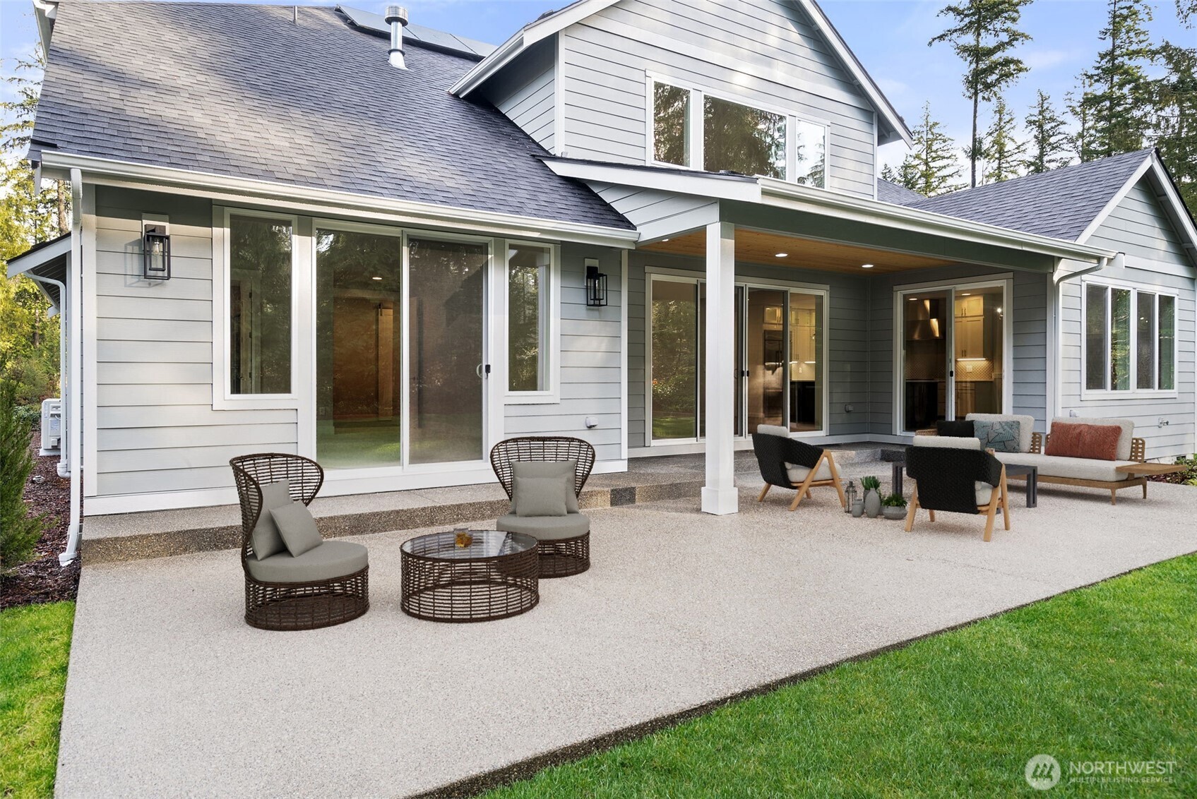 3303 107th Avenue Southwest Olympia, WA 98512 - Photo 35 of 37 a view of a brick house with lawn chairs and a yard