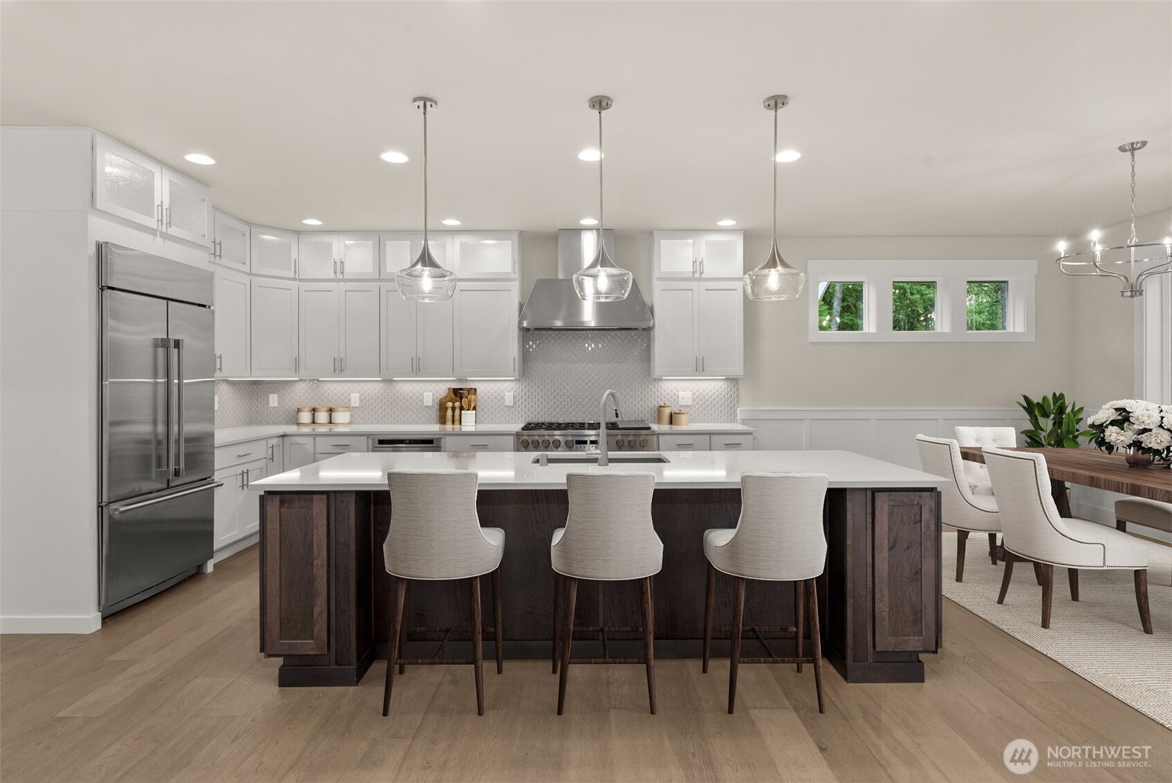 3303 107th Avenue Southwest Olympia, WA 98512 - Photo 4 of 37 a kitchen with a sink and chairs