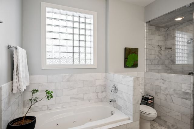 a view of a chairs and a table in the balcony