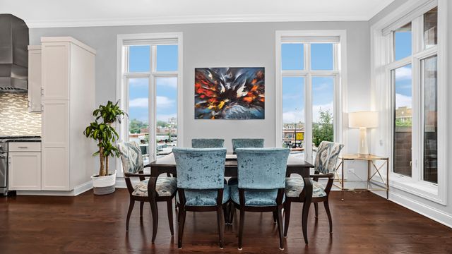 a kitchen with stainless steel appliances granite countertop a sink a stove and a refrigerator