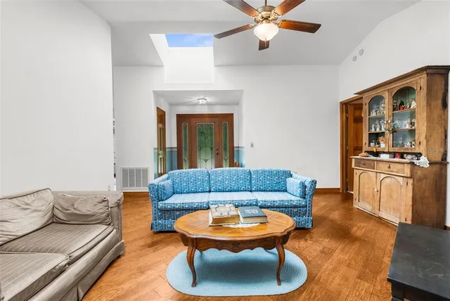 a view of a bedroom with furniture and windows