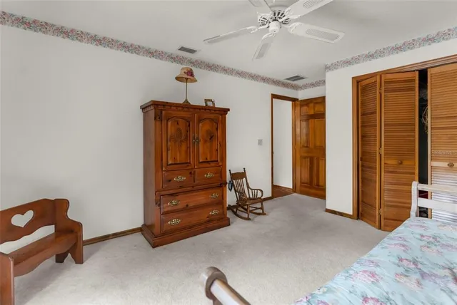 a dining room with wooden floor and furniture