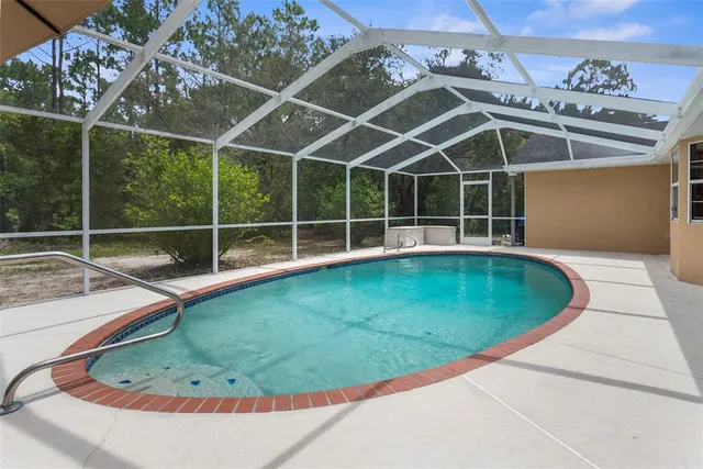a view of balcony with wooden floor and fence