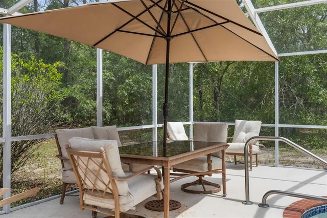 a kitchen with stainless steel appliances granite countertop a stove refrigerator sink and microwave