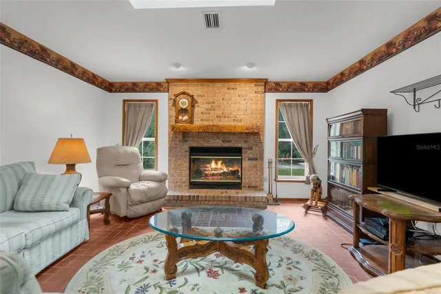 a kitchen with cabinets and chairs