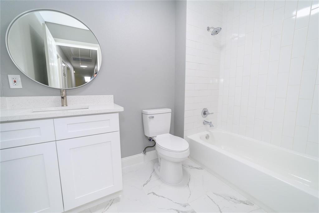 809 Wilcox Street McKinney, TX 75069 - Photo 14 of 26 Full bath featuring vanity and bathing tub / shower combination