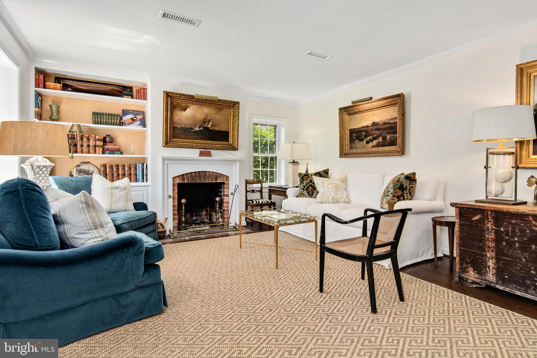105 Thompson Street St. Michaels, MD 21663 - Photo 3 of 24 Living room w/view of fireplace & bookcase