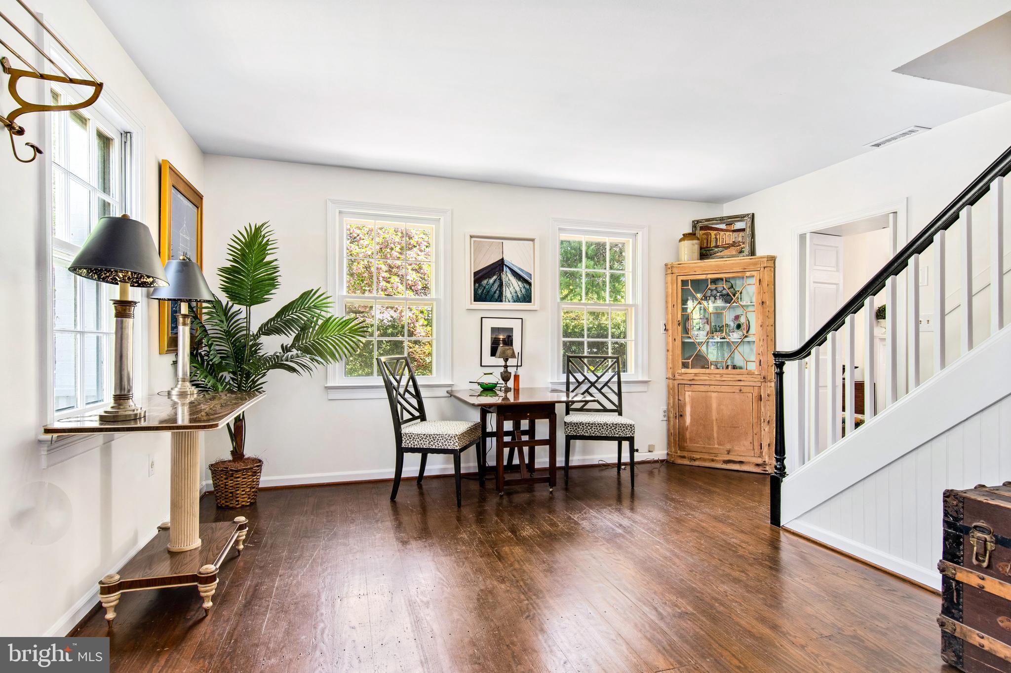 105 Thompson Street St. Michaels, MD 21663 - Photo 5 of 24 Seating/dining area w/view of stairs