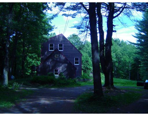 257 East Hill Road Leyden, MA 01337 - Photo 3 of 7 a view of a yard in front of a house with large trees