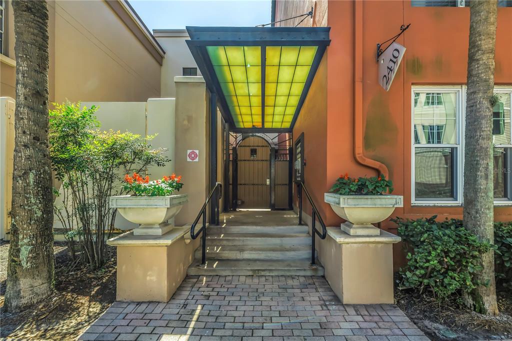 2402 West Azeele Street, Unit 423 Tampa, FL 33609 - Photo 1 of 1 a front view of a house with garden
