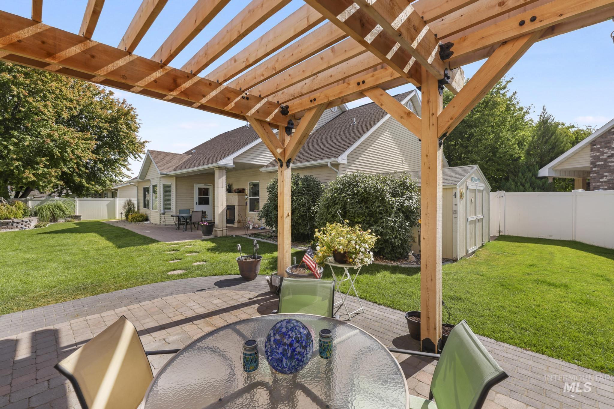 467 Wildrose Loop Twin Falls, ID 83301 - Photo 37 of 46 Expansive paver patio with a wooden pergola structure