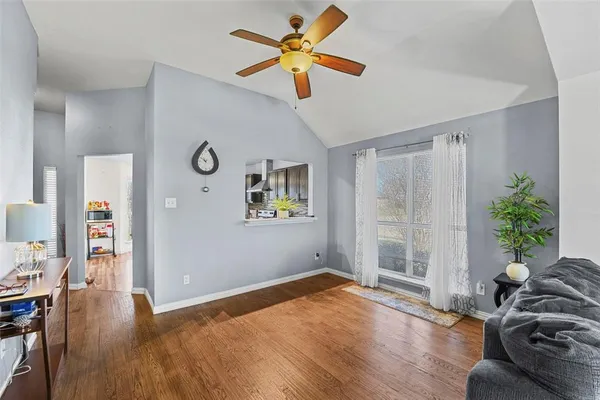 a living room with furniture and a window