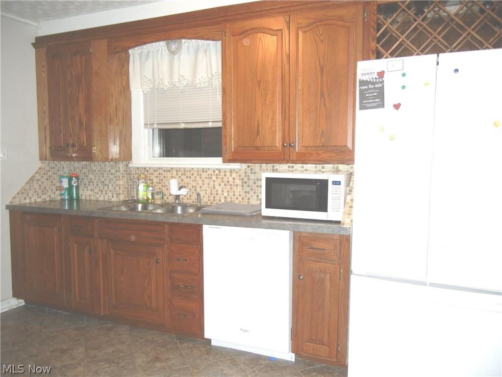 1105 Raff Road Southwest Canton, OH 44710 - Photo 4 of 15 Side of kitchen showing wine rack and dishwasher