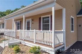 4 Grove Street Moodus, CT 06469 - Photo 2 of 11 a view of a house with a small deck