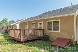 4 Grove Street Moodus, CT 06469 - Photo 3 of 11 a view of backyard with deck and garden