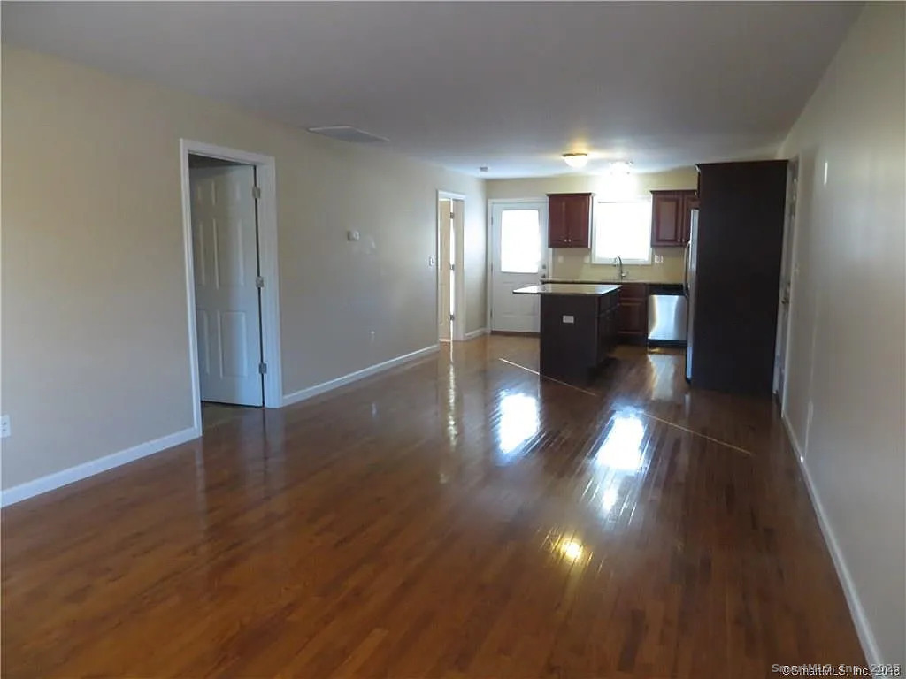 4 Grove Street Moodus, CT 06469 - Photo 5 of 11 a kitchen with counter top space and refrigerator
