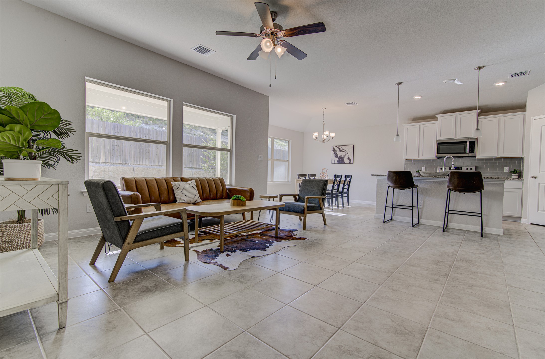 316 Pepper Mill Loop Burnet, TX 78611 - Photo 4 of 27 Natural light floods this inviting living area, flowing seamlessly into the kitchen and dining spaces.