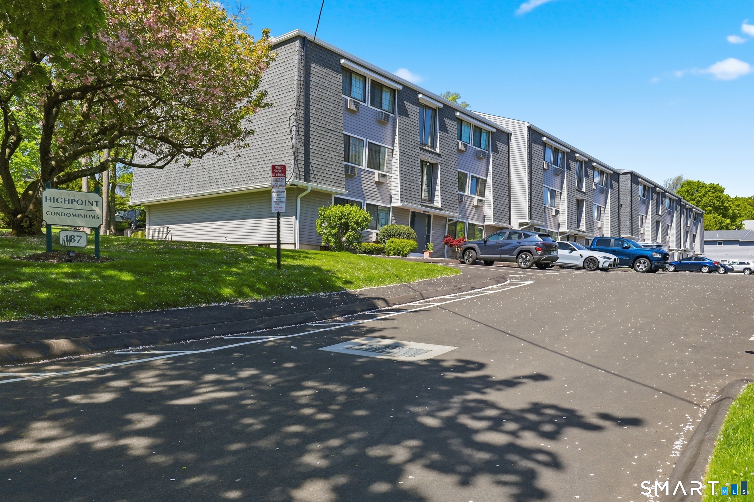 187 Flax Hill Road, Unit D1 Norwalk, CT 06854 - Photo 28 of 32 a city street lined with buildings and trees