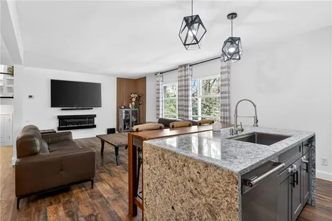 a kitchen with a dining table and chairs