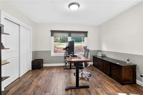 a view of kitchen with furniture and wooden floor
