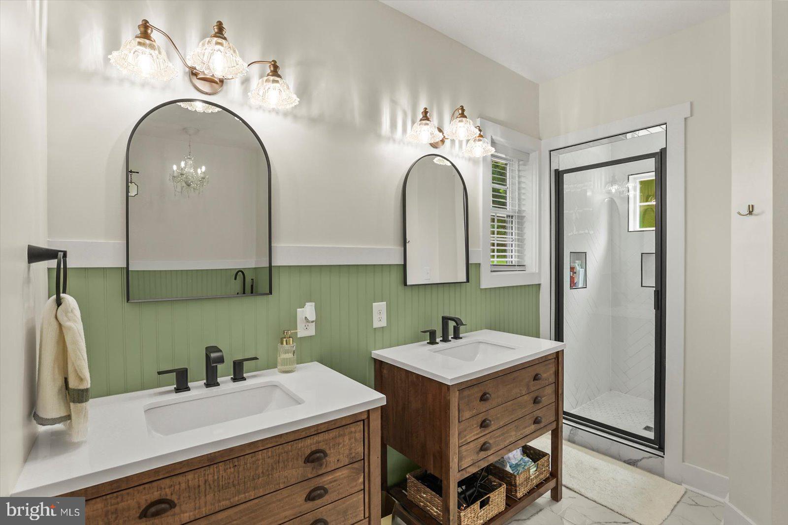 4340 Lee Road Glenville, PA 17329 - Photo 21 of 42 a bathroom with a double vanity sink and a mirror