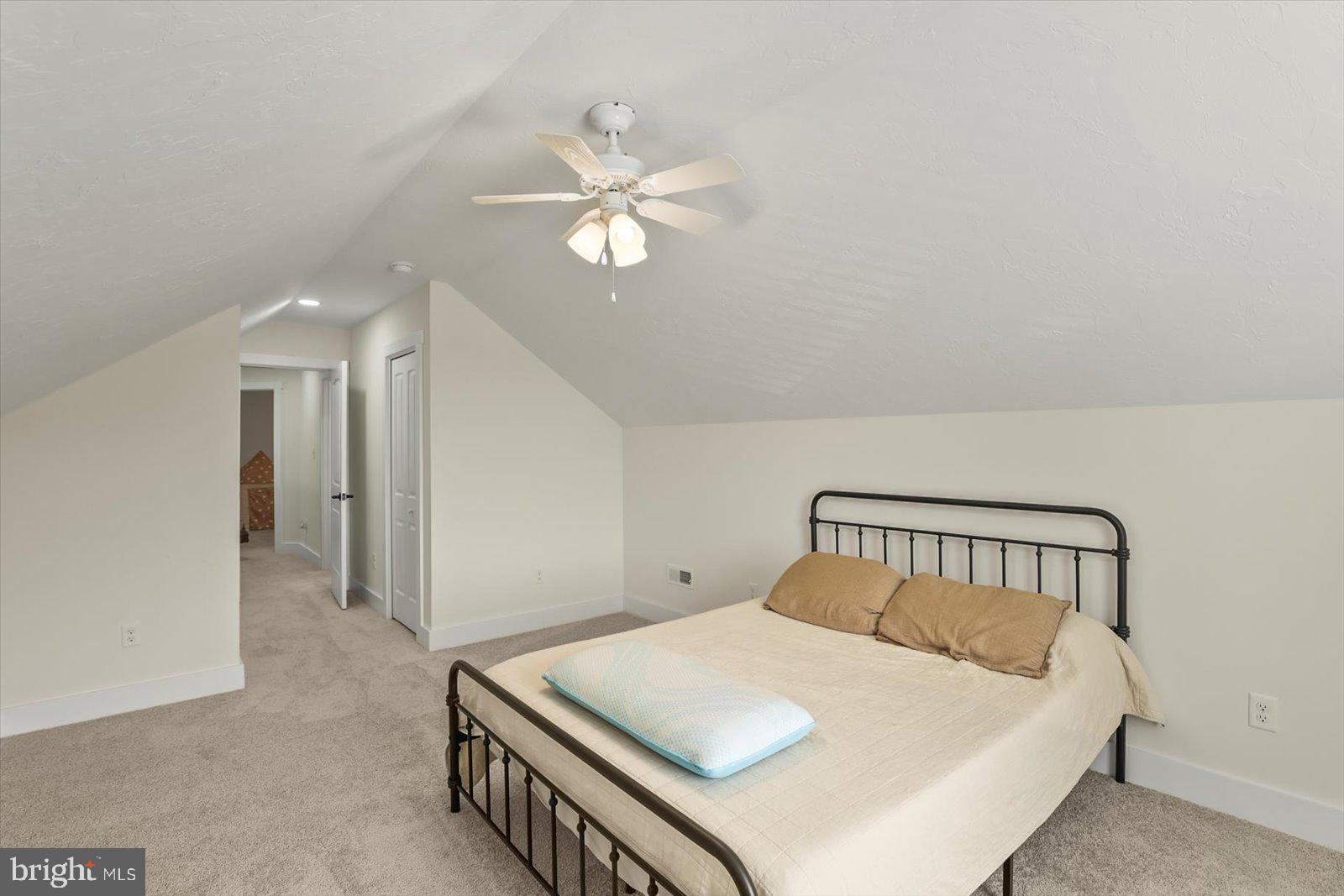 4340 Lee Road Glenville, PA 17329 - Photo 26 of 42 a bedroom with a bed and a chandelier