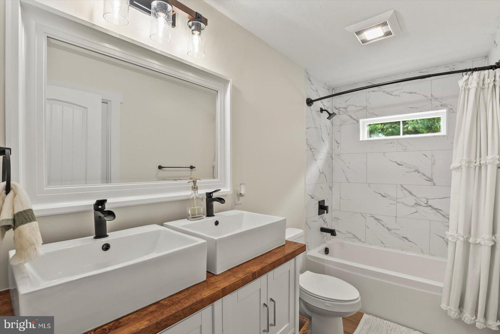 4340 Lee Road Glenville, PA 17329 - Photo 30 of 42 a bathroom with a sink a toilet and a bathtub