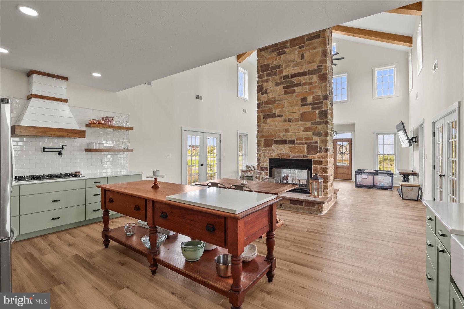 4340 Lee Road Glenville, PA 17329 - Photo 5 of 42 a large living room with stainless steel appliances granite countertop a stove and a fireplace