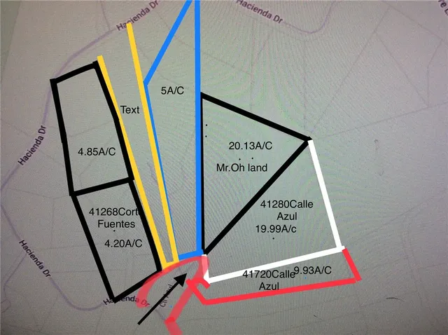 a view of a hallway with wooden stairs