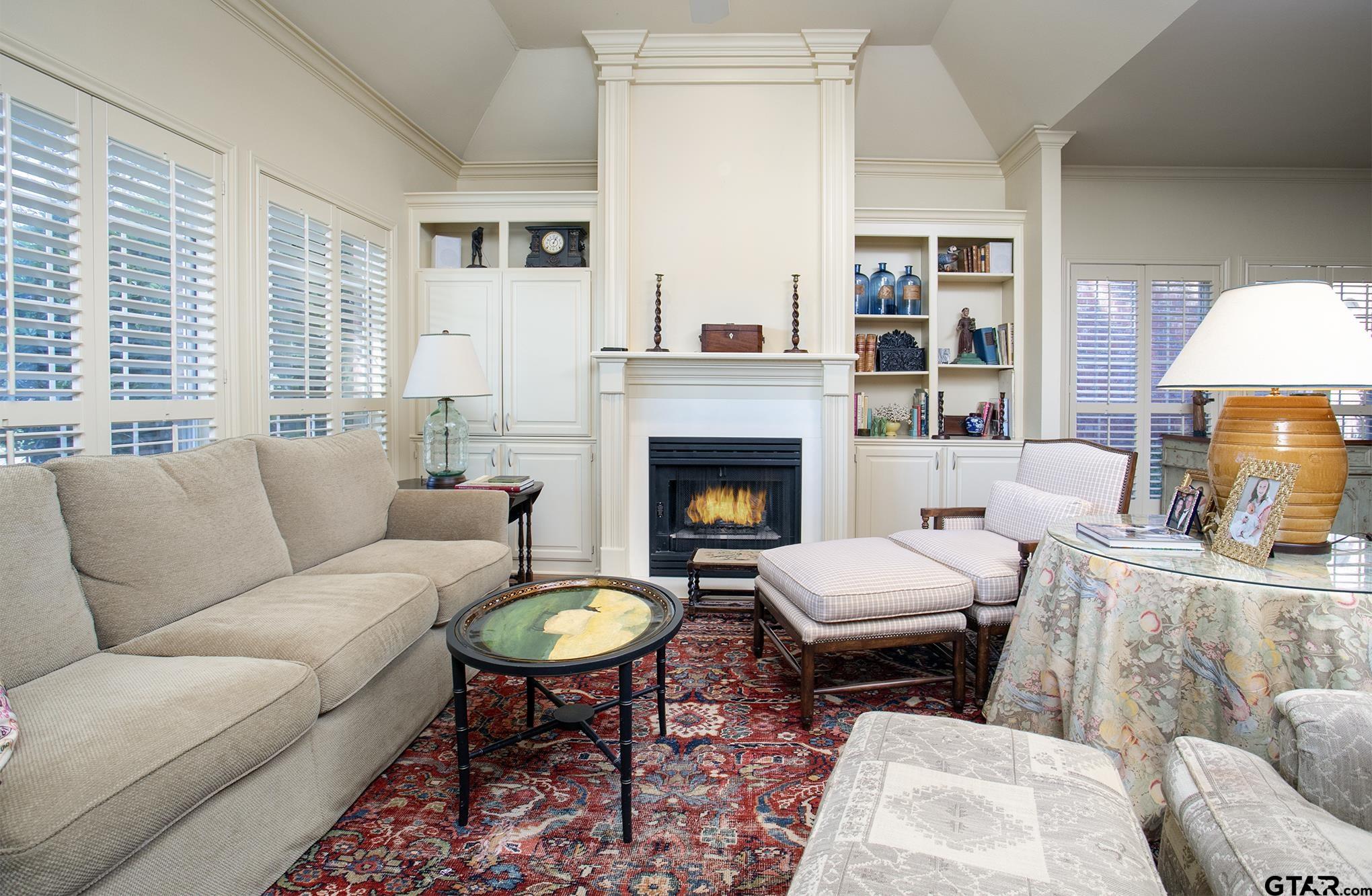 1418 Hollytree Place Tyler, TX 75703 - Photo 12 of 46 a living room with furniture and a fireplace