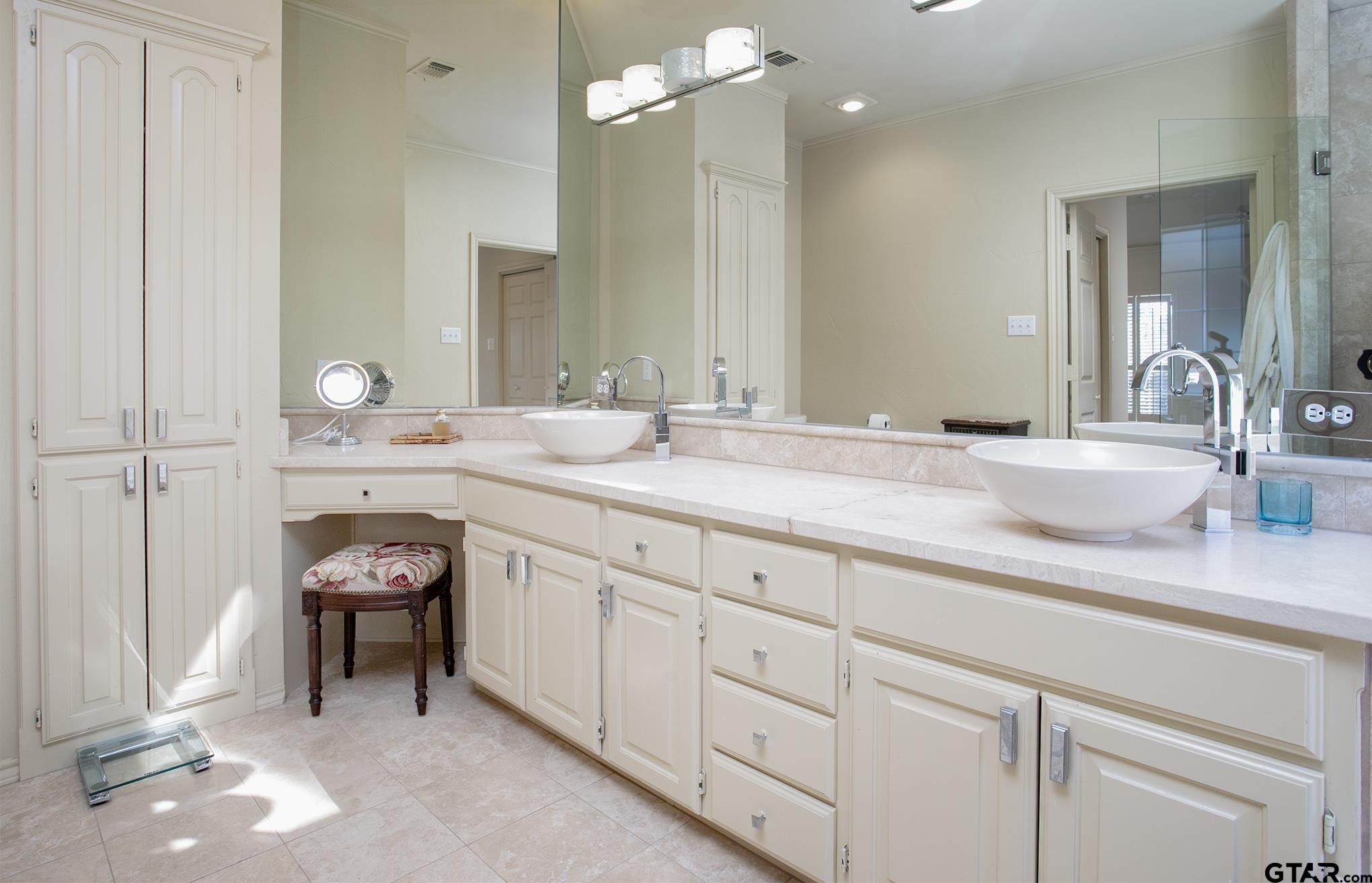 1418 Hollytree Place Tyler, TX 75703 - Photo 25 of 46 a spacious bathroom with double sink and a mirror