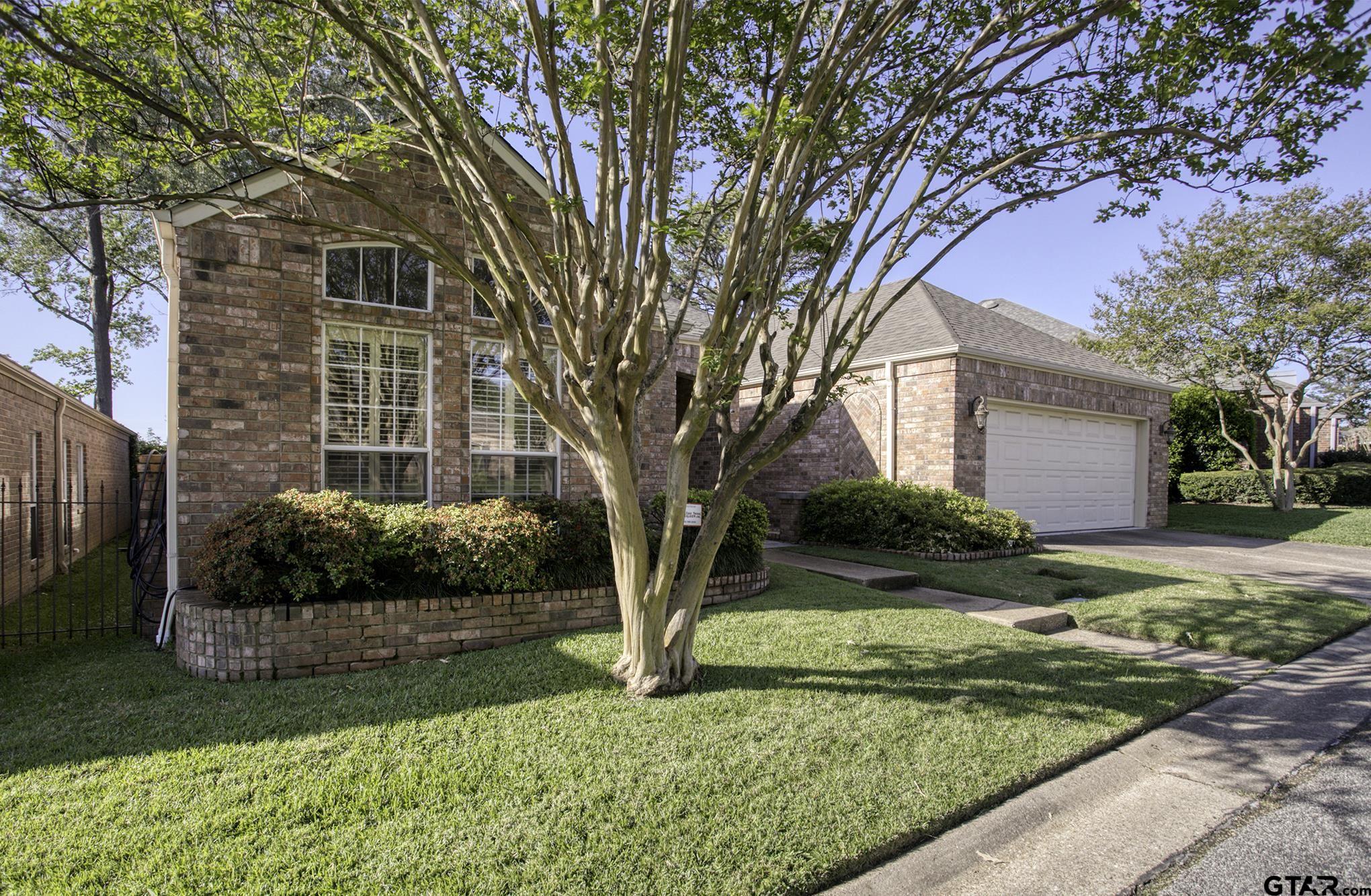 1418 Hollytree Place Tyler, TX 75703 - Photo 35 of 46 a view of a house with a yard