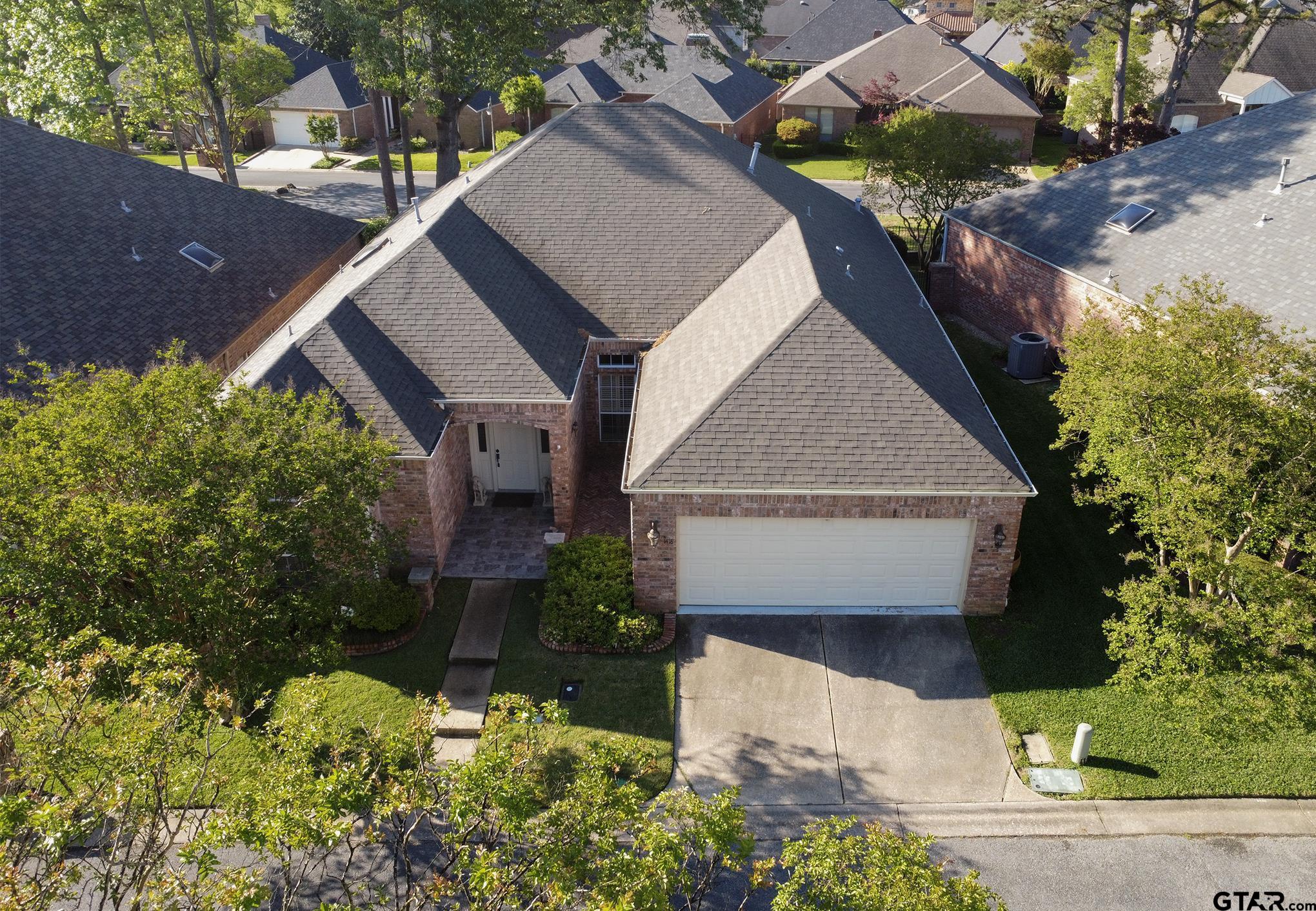 1418 Hollytree Place Tyler, TX 75703 - Photo 38 of 46 front view of house with a yard