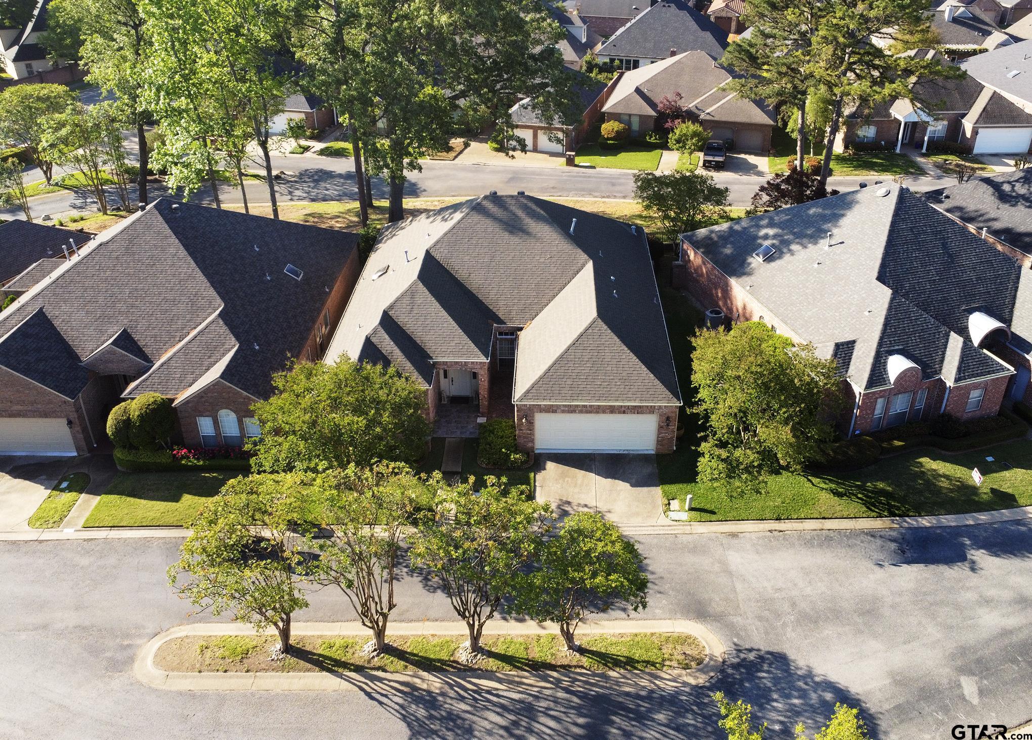 1418 Hollytree Place Tyler, TX 75703 - Photo 39 of 46 an aerial view of a house with a yard and a large tree