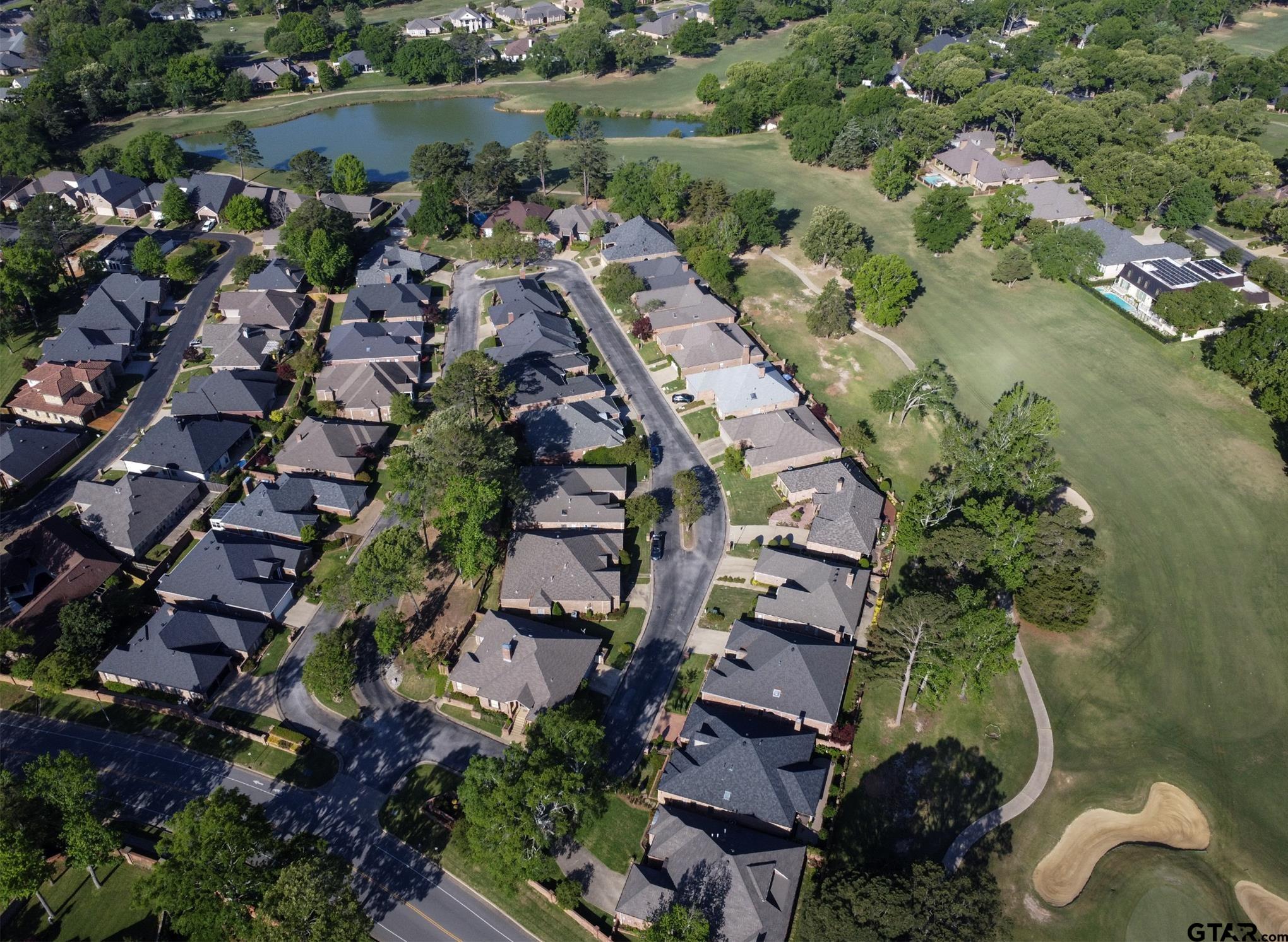 1418 Hollytree Place Tyler, TX 75703 - Photo 44 of 46 an aerial view of a house with a lake view